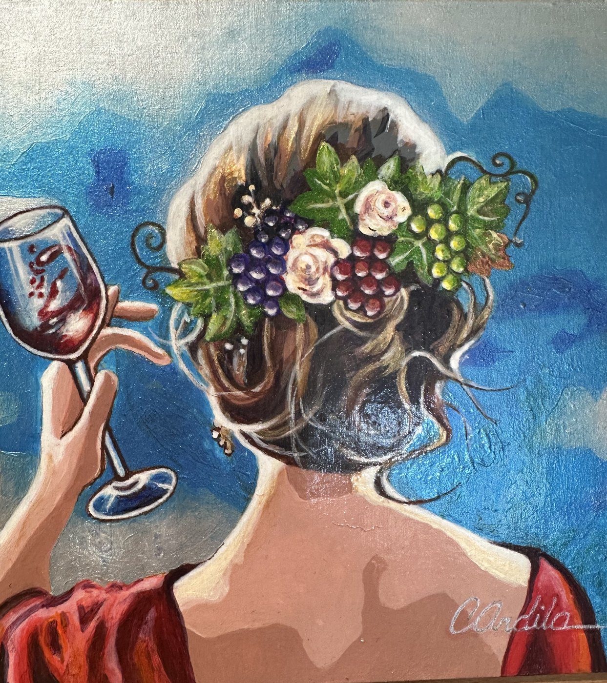 Acrylic painting by Consuelo Ardila of a woman raising a glass of red wine, grapes and roses in her hair