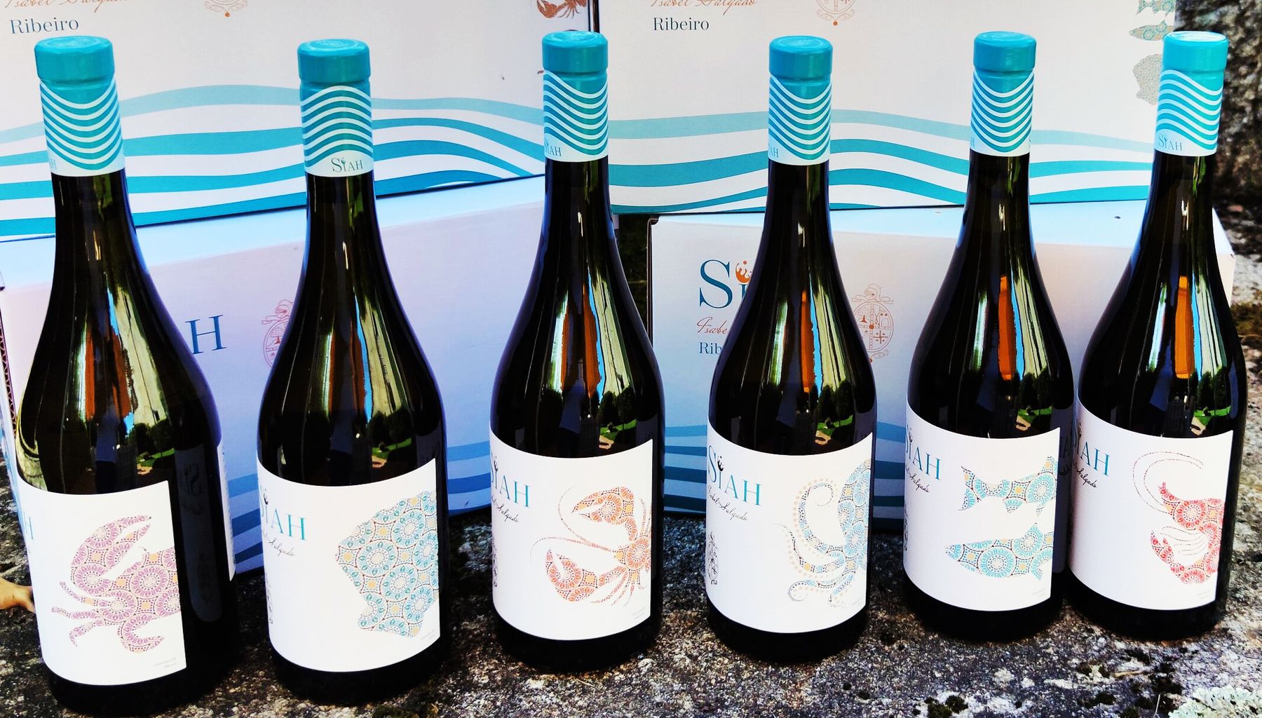 A case of Siah, every bottle carrying a different piece of Galician seafood
